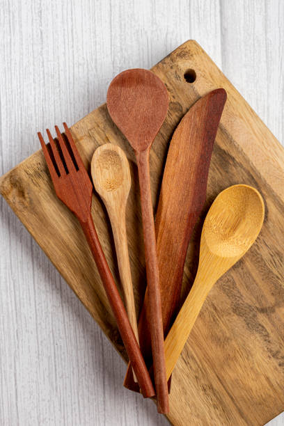 istock Wooden cutlery on wooden table. 1390136761