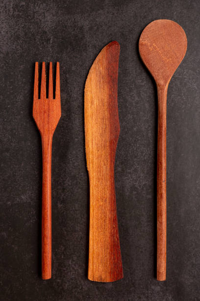 istock Wooden cutlery on dark background. 1390136801