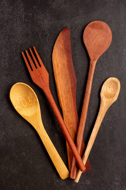 istock Wooden cutlery on dark background. 1390136803