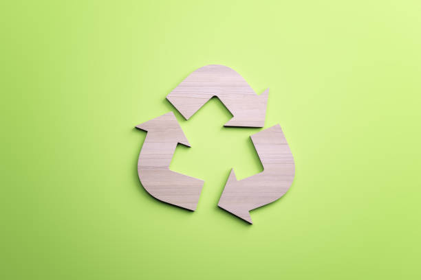 istock White recycle sign on green background. Reuse and waste concept. 3D Rendering. 1390144695