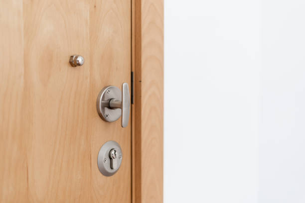 istock Closed modern wooden door with lock in flat 1390148432