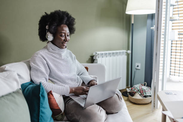 istock Cozy working on laptop at home 1390148545