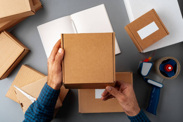 istock Above table top view of warehouse preparing post courier delivery package 1390151985