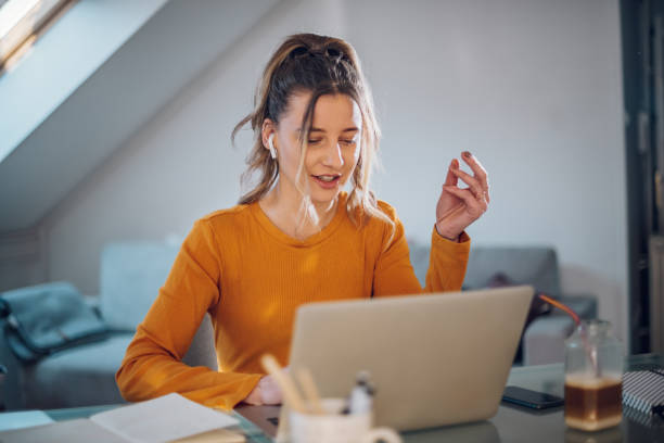 istock Woman having web call on a laptop while working at home 1390153024