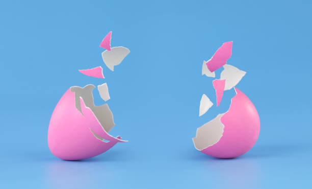 istock Pink Easter egg broken into pieces and cracked open with space for product placement. 1390156711