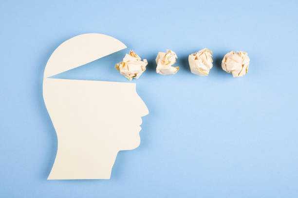 istock Human head in paper cut style with crumpled paper 1390158986