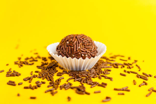 istock Brigadeiro isolated on yellow background 1390159744