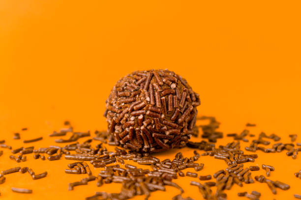 istock Brigadeiro isolated on yellow background 1390159785