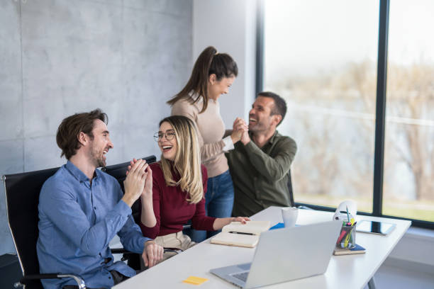 istock Young entrepreneurs celebrating in the office. 1390159960