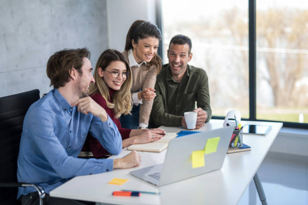istock Young entrepreneurs working together in the office and having fun. 1390160402