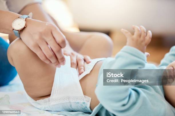 Cropped Shot Of A Woman Changing A Babys Diaper Stock Photo - Download Image Now - Diaper, Baby - Human Age, Changing Diaper