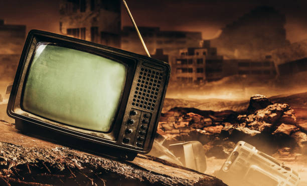 istock Old fashioned tv set on wasteland background. 1390160582