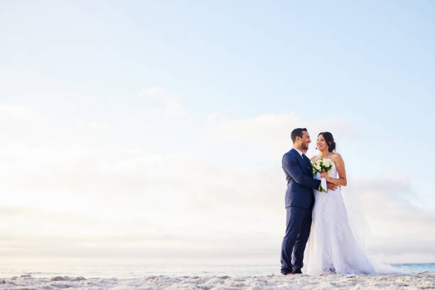Shot of a young couple on the beach on their wedding day You, my love, are my everything free wedding stock pictures, royalty-free photos & images