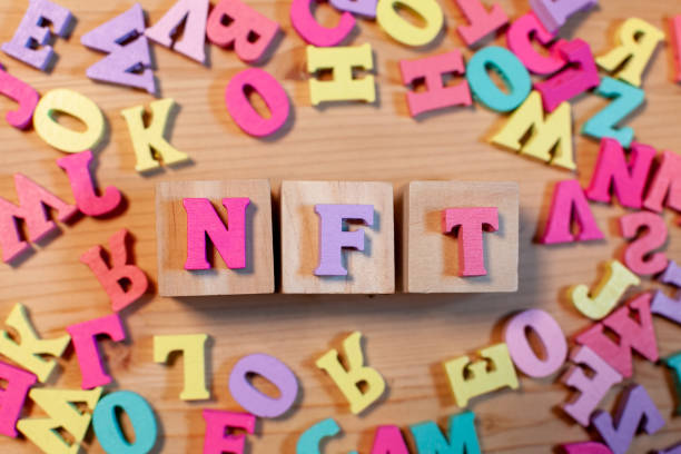istock nft letters on wooden background 1390162669