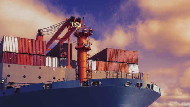 Front view of large blue container cargo ship. Performing cargo export and import operation. Front view of large blue container cargo ship vessel. Performing cargo export and import operations with horizon line and beautiful sky. ships bow photos stock pictures, royalty-free photos & images
