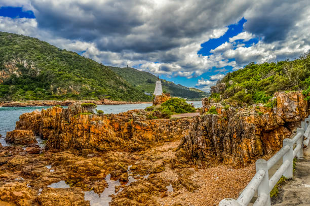 Beautiful rocky Knysna heads beach in garden route in Western Cape in South Africa where lagoon meets the sea stock photo