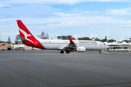 This image is of a Qantas Boeing 737-8 taxiing after landing at the Gold Coast. The qantas flight completed a short flight from Sydney International Airport.