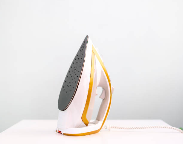 istock a home iron tool, isolated on the shelf, household concept 1390174357
