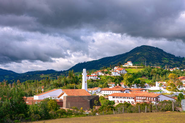 istock Guatavita, Colombia: Looking over terracota tiled roofs, towards the Andes 1390175929