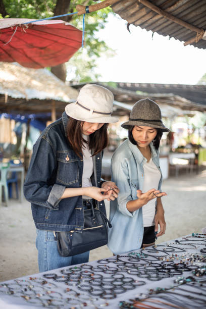 istock two women shopping for souvenirs 1390182514