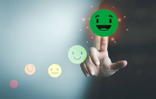 istock Customer satisfaction concept, client is satisfied with pressing the smiley face icon, excellent service, impressed with care, highest rating and score, good feedback from users. 1390183828