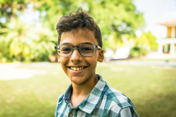istock The child smiles spontaneously on a lawn 1390185660