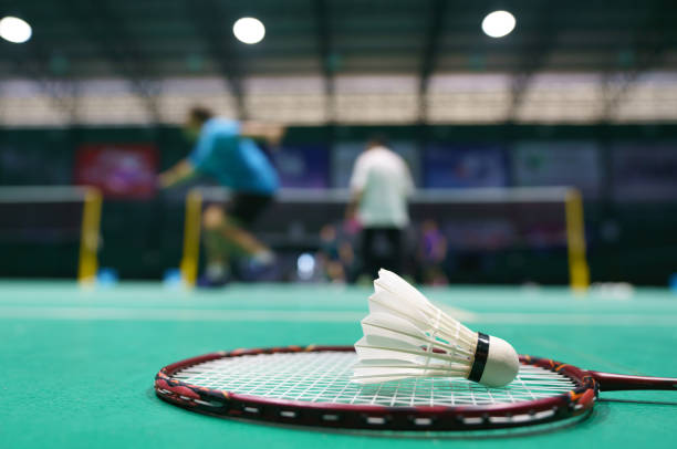 istock shuttlecock on green badminton playing court 1390191053