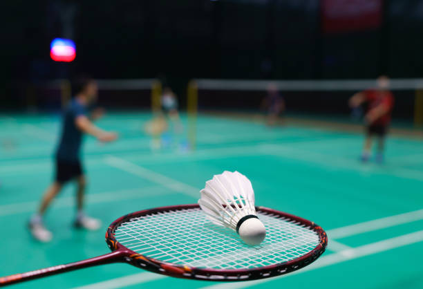 istock shuttlecock on green badminton playing court 1390191094