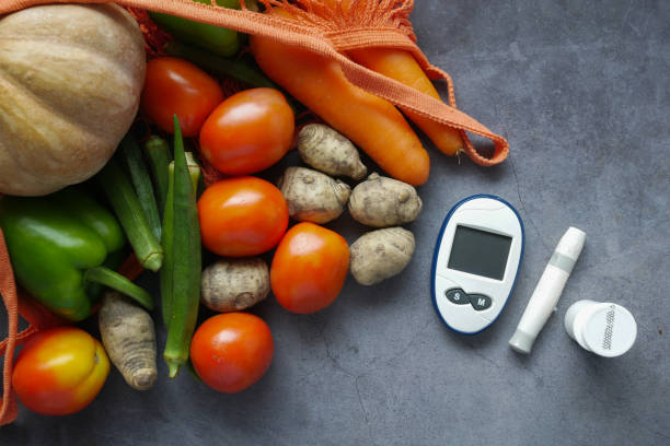 istock diabetic measurement tools and fresh vegetable on table 1390192562