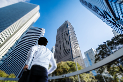 Asian businessman walking in the office district