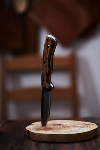 knife upright stabbing in cutting board