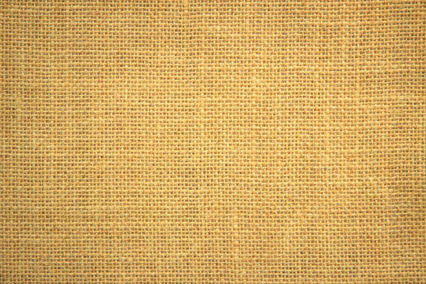 istock Jute hessian sackcloth burlap canvas woven texture background pattern in light beige cream brown color blank. Natural weaving fiber linen and cotton cloth texture as clean empty for decoration. 1390198899