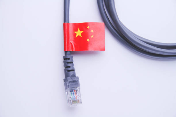 istock Internet cable with China flag. Connecting a PC to the Internet in China. 1390201988