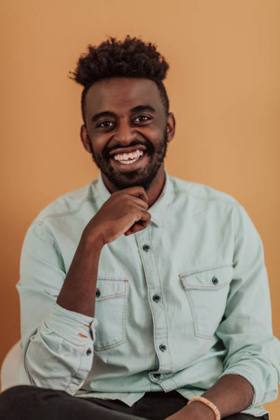 istock African student using laptop computer to study and make business connections yellow background 1390205470