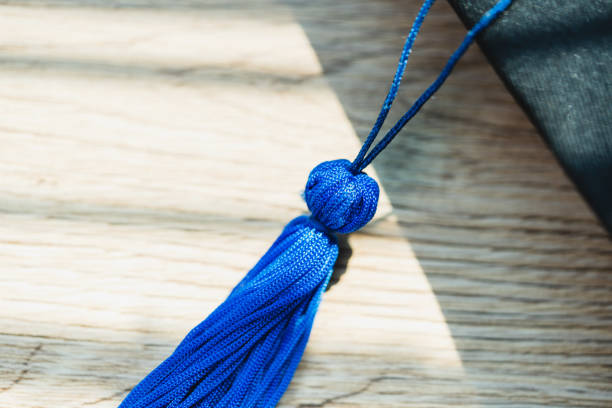 istock Black graduation cap University level, placed on a wooden table, concept, graduation 1390206724