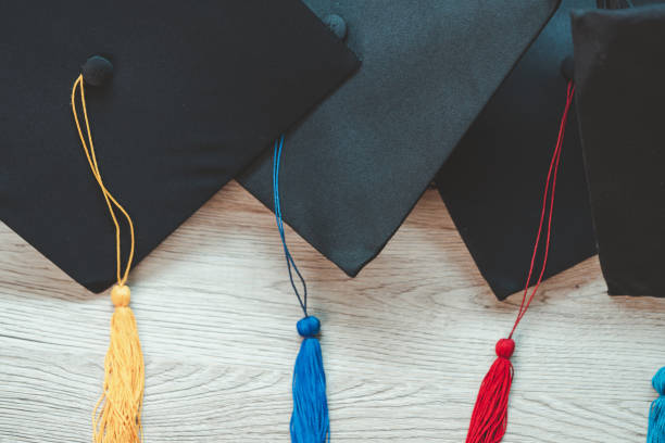 istock Black graduation cap University level, placed on a wooden table, concept, graduation 1390207307