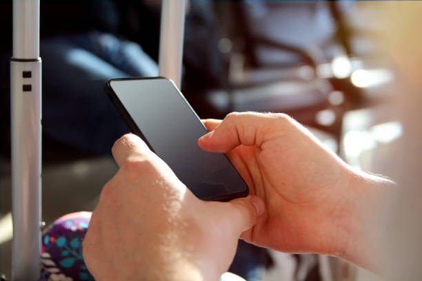 istock Passenger is waiting the delayed flight at the airport. Man is texting the message on a mobile phone 1390210511