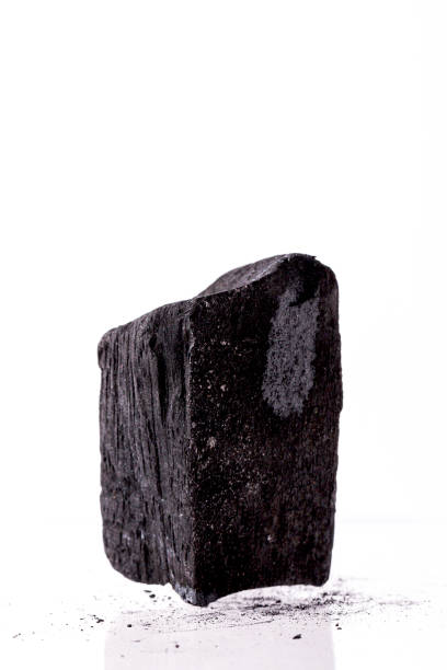 istock Natural wood charcoal Isolated on white background. 1390211403