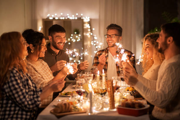 istock happy friends having christmas dinner at home 1390215173