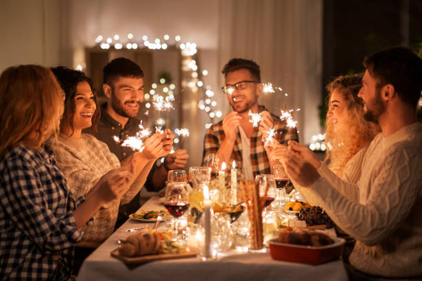 istock happy friends having christmas dinner at home 1390215238