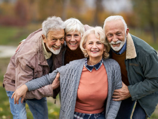 istock Happy embraced seniors enjoying in the park. 1390216442
