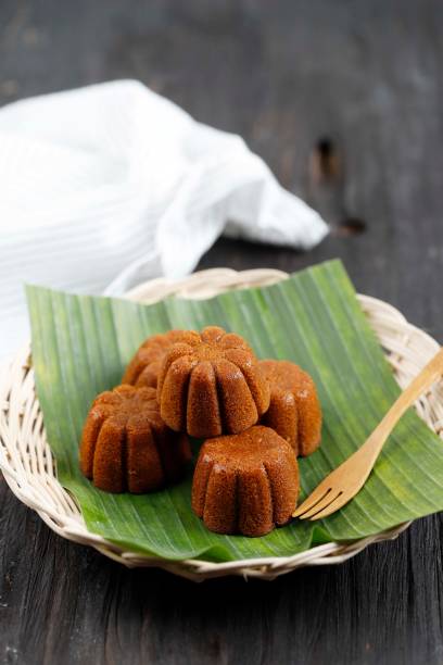 istock Bolu Sakura Steamed Caramel Cake, Made from Caramel with Cake Batter from Egg, Sugar, Flour, and Butter. Served on Wooden Plate with Banana Leaf. 1390217821