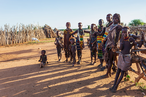 Turmi, Omo River Valley, Ethiopia - May 10, 2019: Portrait of a beautiful woman with children in Hamar village. Hamars are the original tribe in southwestern Ethiopia. South Ethiopia Africa