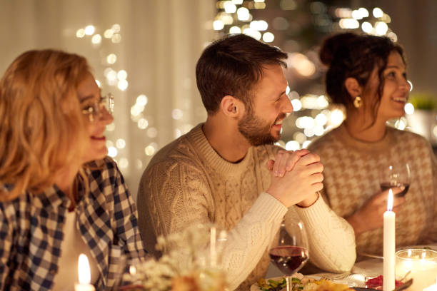 istock happy friends having christmas dinner at home 1390219116