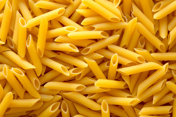 istock Uncooked Raw Organic Penne Pasta 1390219247