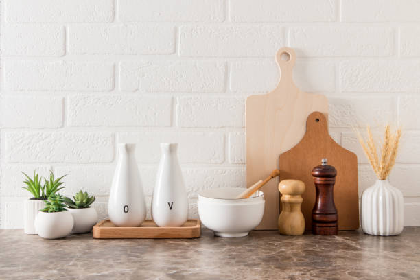 istock various kitchen utensils on a marble countertop in a modern kitchen. the concept of decor against the background of a white brick wall. 1390222102