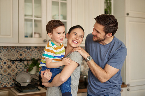 Parents spending their time with adorable baby boy at home