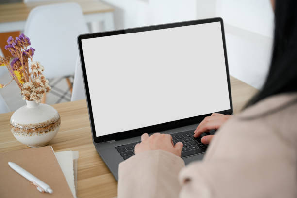 istock Back side, close-up, Businesswoman is working on laptop computer. 1390227951