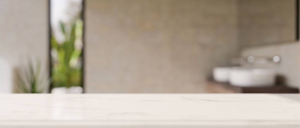istock Mockup space on luxury white tabletop against blurred modern bathroom background. 1390229098