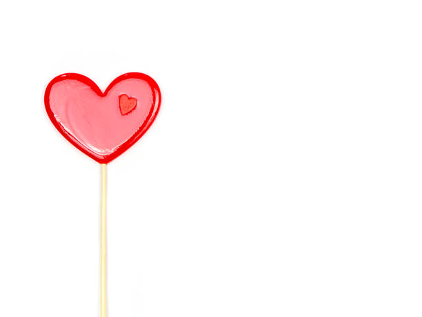 istock Lollipop hearts on white background. Congratulations, space for text. 1390229836